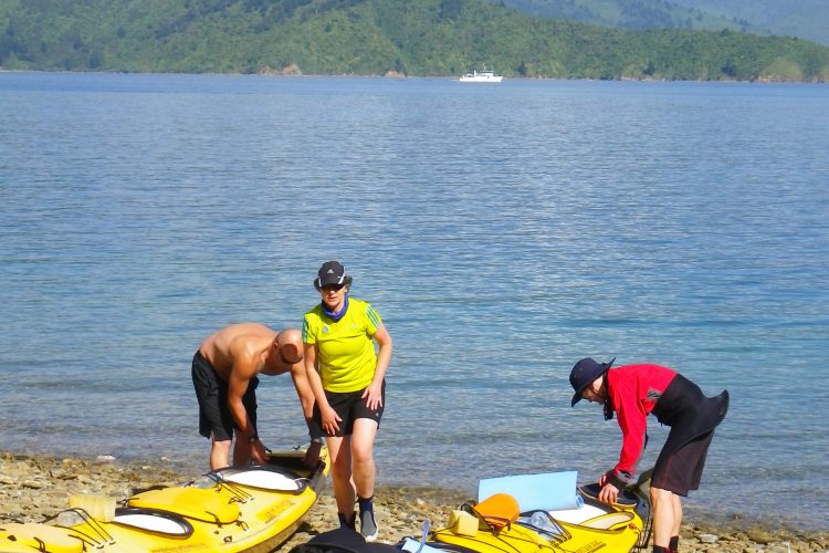 Packing sea kayaks on 3 day Outer-Queen Charlotte Sound Marlborough Sounds NZ